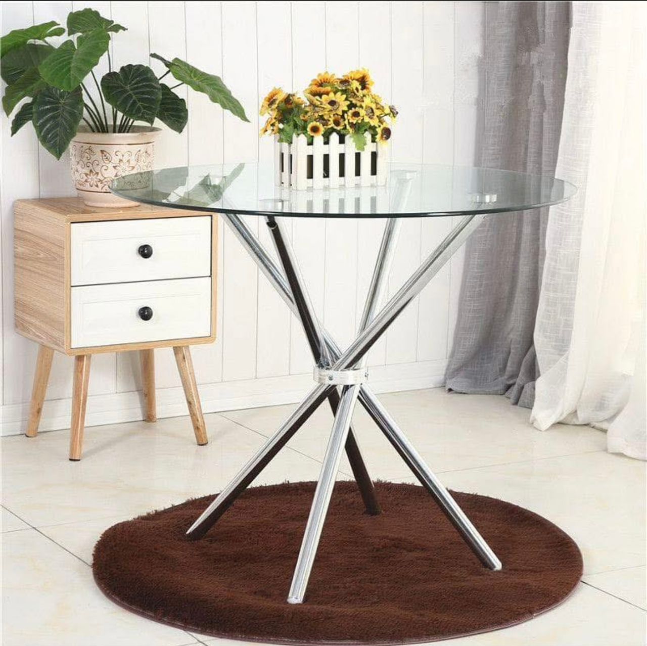 Promo : 18000f .                            Table de salle à manger ronde de luxe moderne en métal et verre et très solide.